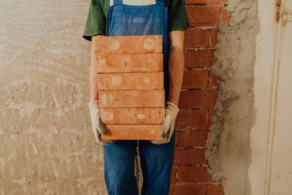 Picking up bricks after building a brickwall